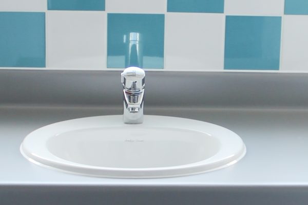 Primary School basins tiled splashback